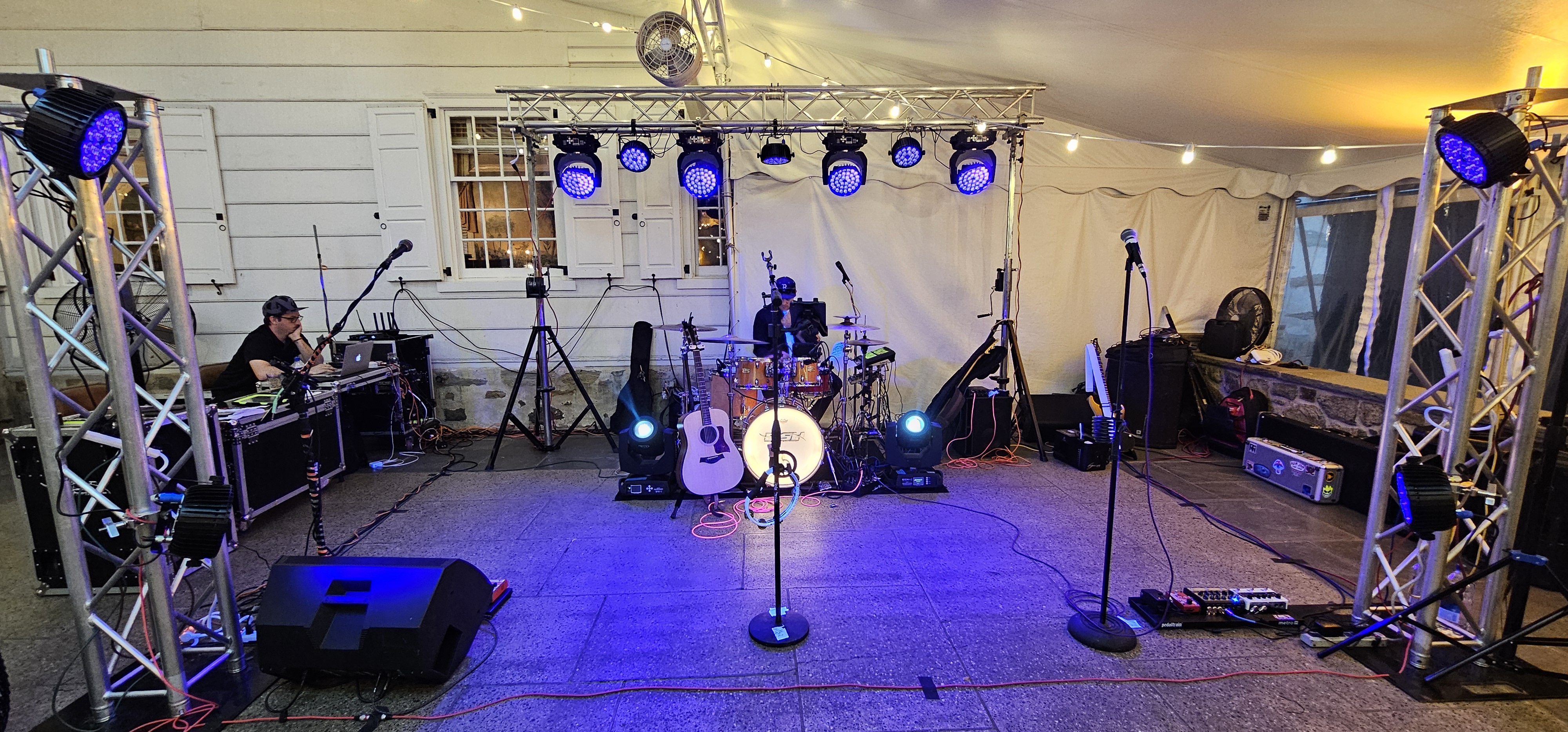 Professional stage setup with lighting truss in outdoor tent